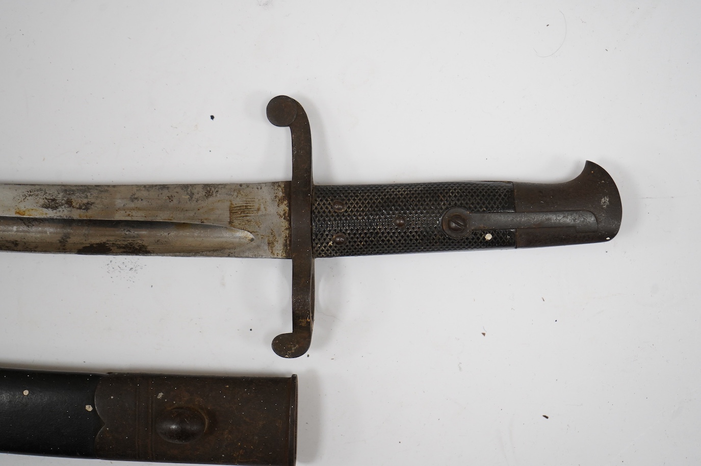 A Middlesex Rifle Volunteers bayonet, named to George Brooking, with regimental badge, owner’s name and initials, all on the blade, regulation Enfield hilt and iron mounted leather scabbard. Condition - fair.